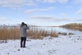 Birder by a bay in winter season Royalty Free Stock Photo