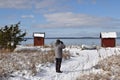 Birder watching by the coast in winter season