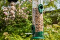 Birdfeeder full of bird seed mix Royalty Free Stock Photo