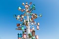 Birdhouse, bird house. Many wooden multi-colored houses on a decorative tree. Against the background of the blue sky. copy space. Royalty Free Stock Photo