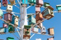 Birdhouse, bird house. Many wooden multi-colored houses on a decorative tree. Against the background of the blue sky. copy space. Royalty Free Stock Photo