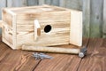 Birdhouse for the birds on wood background