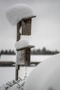 Birdhouse covered with snow outdoor