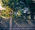Birdhouse on a fence