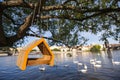 Birdhouse hanging from tree over river Royalty Free Stock Photo