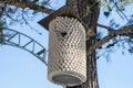 Birdhouse made from corks from wine bottles. Birdhouse on pine tree