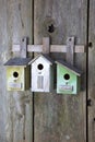 Birdhouse on old wooden fence Royalty Free Stock Photo