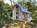 Birdhouse wood barn on post