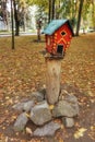 Birdhouses in the autumn central city park of Vinnitsa