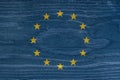 European Union flag with the texture of wood. European Union flag on wooden texture.