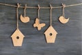 Birds, birdhouses, butterflies on a rope Royalty Free Stock Photo