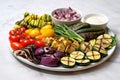 birds eye view of an assorted grilled vegetable platter on a blue table Royalty Free Stock Photo