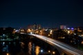 Birds-eye view of busy downtown street at night.