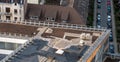 Birds eye view of a roof construction site. Professional placing of gravel stones on a flat roof builing