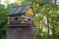 Birds feeder in the form of a timbered lodge Royalty Free Stock Photo