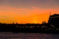 Birds flock and burning sunset at the Moscow river embankment Royalty Free Stock Photo
