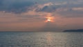 Birds Flock Flying over Lake Leman with Sunrise behind Clouds an Royalty Free Stock Photo