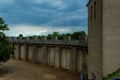 Birds flying over a reconstructed Roman wall in the Colonia Ulpia Traiana