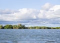 Birds flying over river in v formation Royalty Free Stock Photo