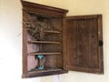 Birds nest in a corner cabinet in an old country house room Royalty Free Stock Photo