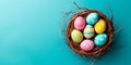 A birds nest with pastel Easter eggs, each uniquely painted with unique pattern on a solid background Royalty Free Stock Photo