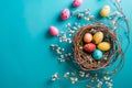 A birds nest with pastel Easter eggs, each uniquely painted with unique pattern on a solid background Royalty Free Stock Photo