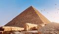 Birds over old pyramid Of Giza at sunset Cairo, Egypt Royalty Free Stock Photo