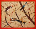 Birds are sitting on the branches with red berries. Handmade vintage design