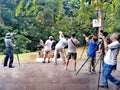 Birdwatchers taking photographs in nature park