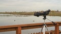 Birdwatching monocular on a tripod on boardwalk Royalty Free Stock Photo