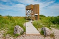 Birdwatching tower. Wooden observation tower against the blue sky.