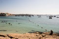 Birdzebbugia, Malta, August 2019. Fence line of buoys of a city beach.