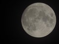Birght full moon captured in the dark sky at night