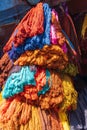 Birghtly colored yarn for sale at a market in Srinagar