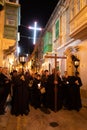 Night Christian procession through the streets of the old Maltese city