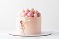 Birhtday cake for a girl with chocolate spheres decoration on top. Little girl holding air balloons Royalty Free Stock Photo