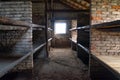 Birkenau, Poland Ã¢â¬â December 15, 2019: Wooden bunk beds in a barrack in Auschwitz - Birkenau Concentration Camp Royalty Free Stock Photo