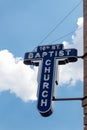 Birmingham Alabama, USA - May 16, 2019: View looking up at the sign on the exterior of the 16th Street Baptist church with blue Royalty Free Stock Photo