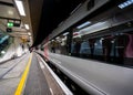 Birmingham Grand Central Station empty train platform with train waiting lights reflected on window futuristic design glass and