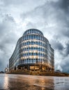 Birmingham Paradise Island new modern regeneration buildings from low angle with dramatic storm clouds and wet floor windows lit Royalty Free Stock Photo