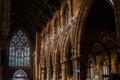 BIRMINGHAM, UK - March 2018 Stained Glass Window at the Far End Wall. Archs and Columns Dividing the Passageway from Royalty Free Stock Photo