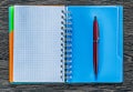 Biro pen checked notepad on vintage wooden board