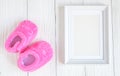 Birth of child - blank picture frame on wooden background Royalty Free Stock Photo