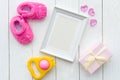 Birth of child - blank picture frame on wooden background Royalty Free Stock Photo