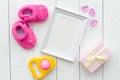 Birth of child - blank picture frame on wooden background Royalty Free Stock Photo