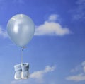 Birth concept:balloon carrying blue baby booties Royalty Free Stock Photo