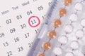 Birth control pills , calendar and notepad on table Royalty Free Stock Photo