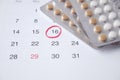 birth control pills , calendar and notepad on table Royalty Free Stock Photo