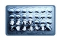 Foil blister pack of birth control pills missing some pills. white background