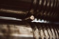 Birth of detail. Woman goldsmith creating metal detail on craft rolling machine